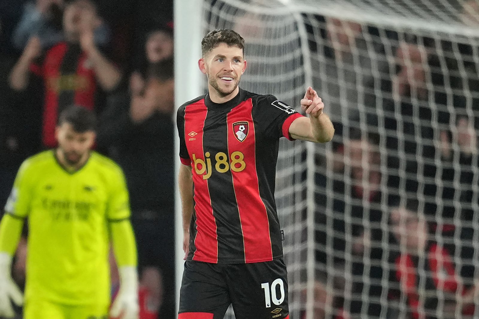 Bournemouth's Ryan Christie celebrates after scoring his side's opening goal during the English Premier League soccer match between Bournemouth and Arsenal at the Vitality Stadium in Bournemouth, England, Saturday, Oct. 19, 2024. (AP Photo/Kin Cheung)