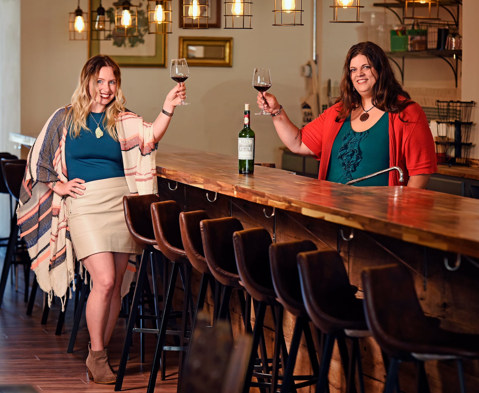 West Central Wine co-owners  Monica Nenni, left, and Melissa Kutzera tracked down the daughter of a man who wrote then hid a note in the basement of their business nearly 60 years ago. 