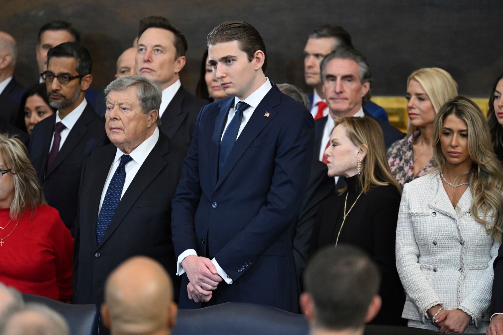 Barron Trump, center, attends the 60th Presidential Inauguration in the Rotunda of the U.S. Capitol in Washington, Monday, Jan. 20, 2025. (Saul Loeb/Pool photo via AP)