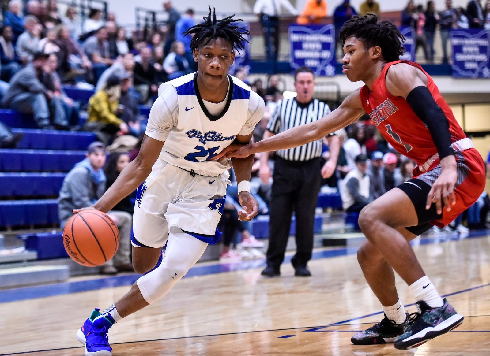 Hamilton’s D’Marco Howard dribbles around Princeton’s Kaleb Crawford during Friday night’s game at the Hamilton Athletic Center. Princeton won 44-43. NICK GRAHAM/STAFF