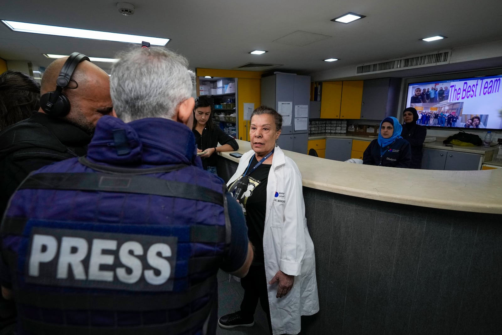 Foreign and local journalists take a tour inside Sahel General Hospital, in Dahiyeh, Beirut, Lebanon, Tuesday, Oct. 22, 2024, a day after the Israeli army said that Hezbollah is storing hundreds of millions of dollars in cash and gold under the hospital. (AP Photo/Hassan Ammar)