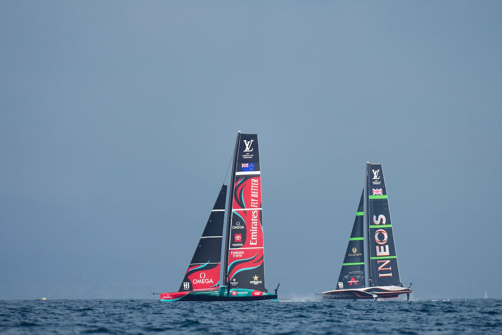 Ineos Britannia and Emirates Team New Zealand race during the Louis Vuitton 37th America's Cup race in Barcelona, Spain, Saturday, Oct. 12, 2024. (AP Photo/Bernat Armangue)