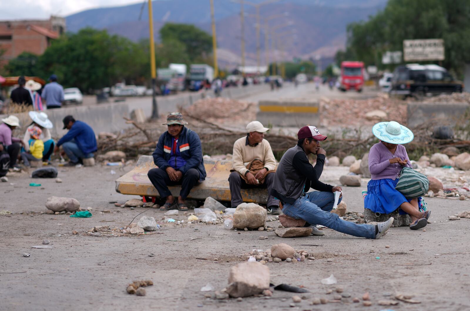 Supporters of former Bolivian President Evo Morales block a road as pressure to prevent the former leader from facing a criminal investigation over allegations of abuse of a minor, near Cochabamba, Bolivia, Saturday, Oct. 26, 2024. (AP Photo/Juan Karita)