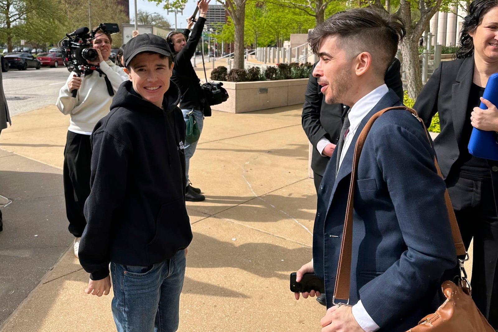 FILE - ACLU attorney Chase Strangio, right, and actor Elliot Page leave the 8th U.S. Circuit Court of Appeals after a hearing, April 11, 2024, in St. Louis. (AP Photo/Jim Salter, File)