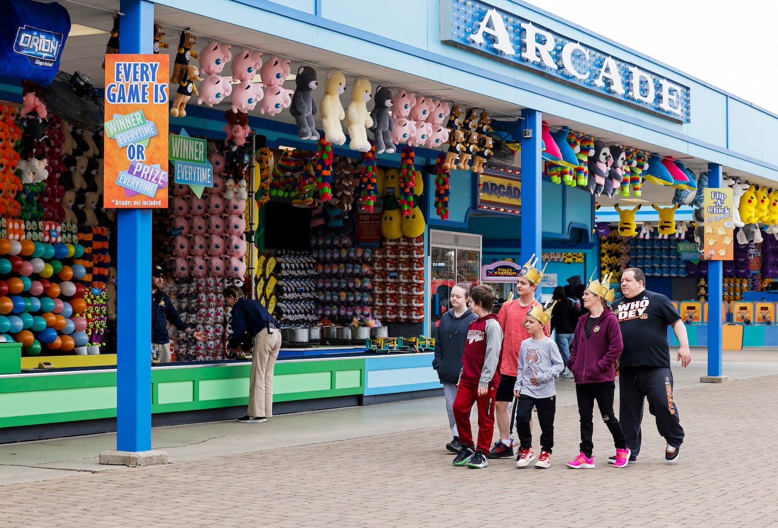 Visitors stroll through the games section at Kings Island in Mason, Ohio. NICK GRAHAM/STAFF