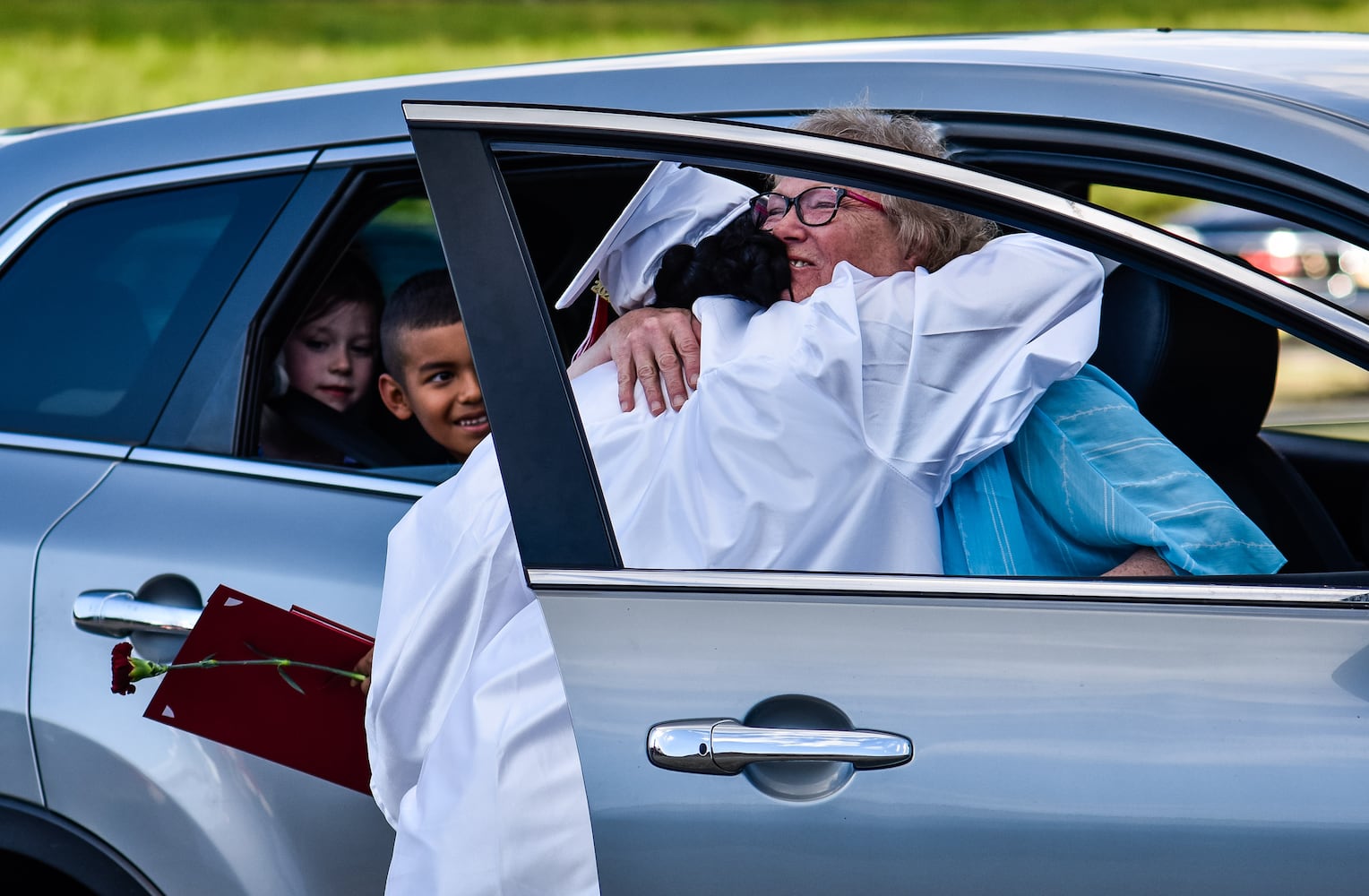 Madison High School drive-thru graduation ceremony at Land of Illusion