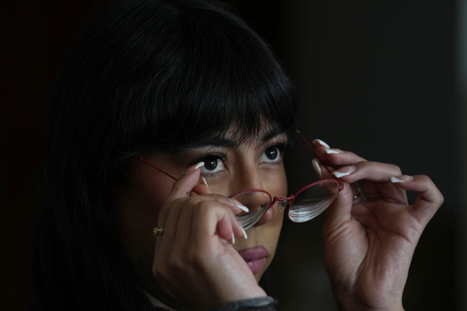 Mexican journalist Laurel Miranda adjusts her glasses during an interview about the film Emilia Perez in Mexico City, Friday, Jan. 24, 2025. (AP Photo/Marco Ugarte)