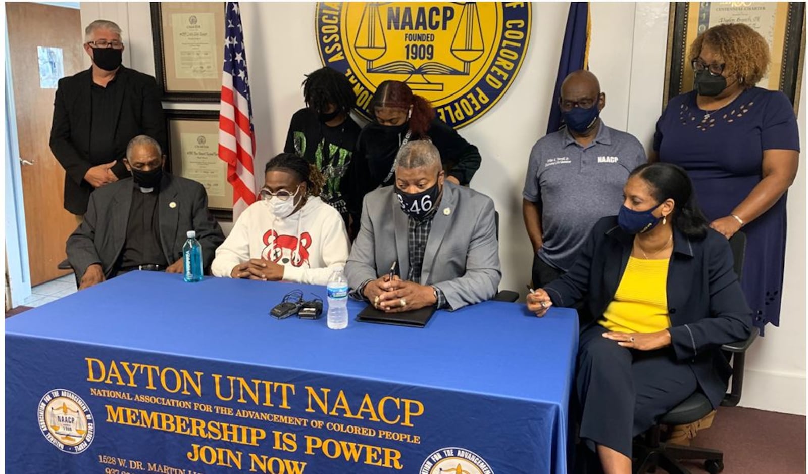 Clifford Owensby Sr., second from left, appears at a press conference Sunday with officials of the NAACP Dayton Unit to tell his side of an incident in which he was forcibly removed from his vehicle during a Sept. 30 traffic stop for an alleged window tint violation. Owensby is a paraplegic and could not step out of the vehicle as police ordered. At the table from left are the Rev. David Fox, Owensby, Derrick Foward, NAACP Dayton unit president, and Mattie P. White, first vice president of NAACP Dayton Unit. The incident remains under investigation by police. ED RICHTER/STAFF