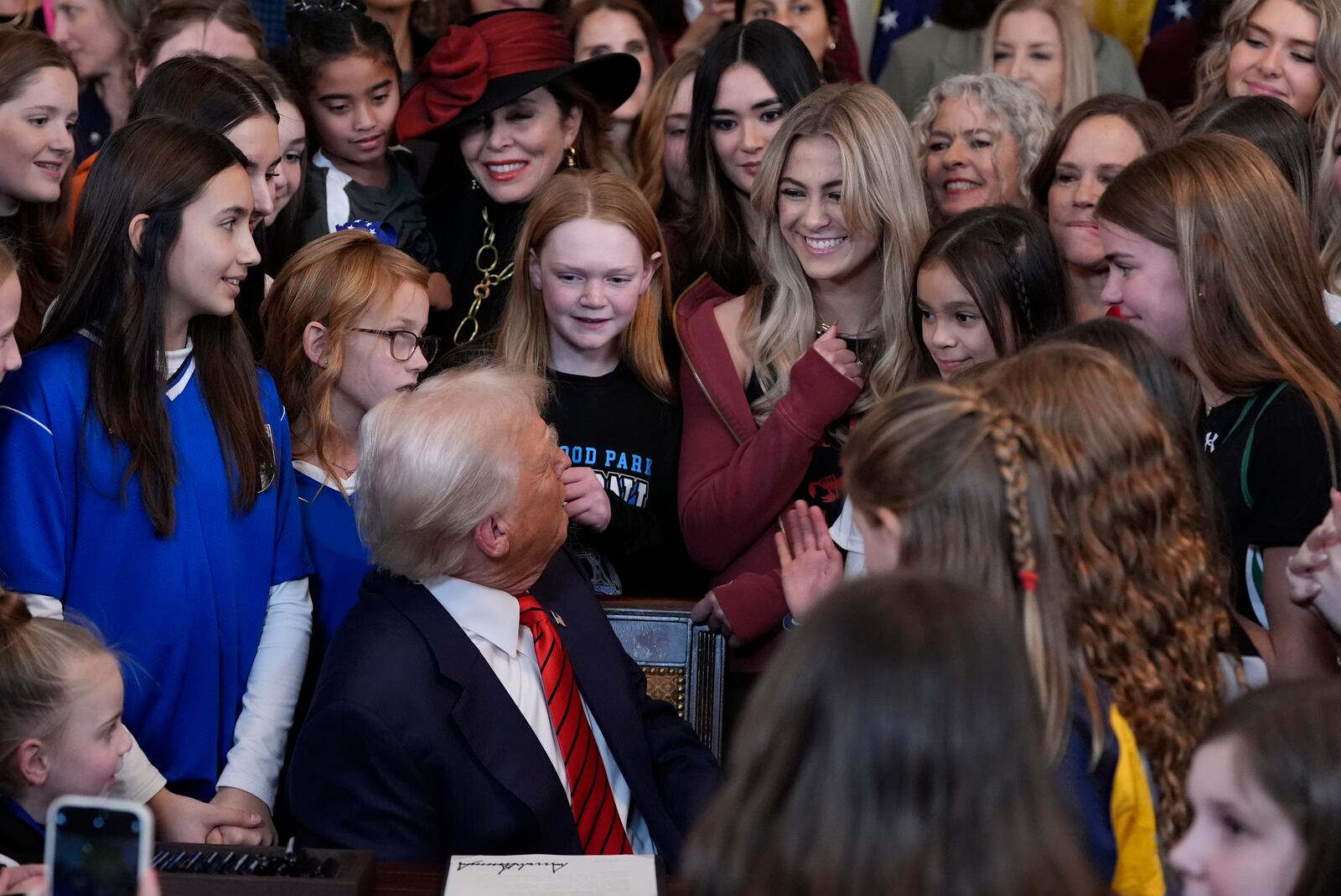 President Donald Trump looks back after he signs an executive order barring transgender female athletes from competing in women's or girls' sporting events, in the East Room of the White House, Wednesday, Feb. 5, 2025, in Washington. (AP Photo/Alex Brandon)