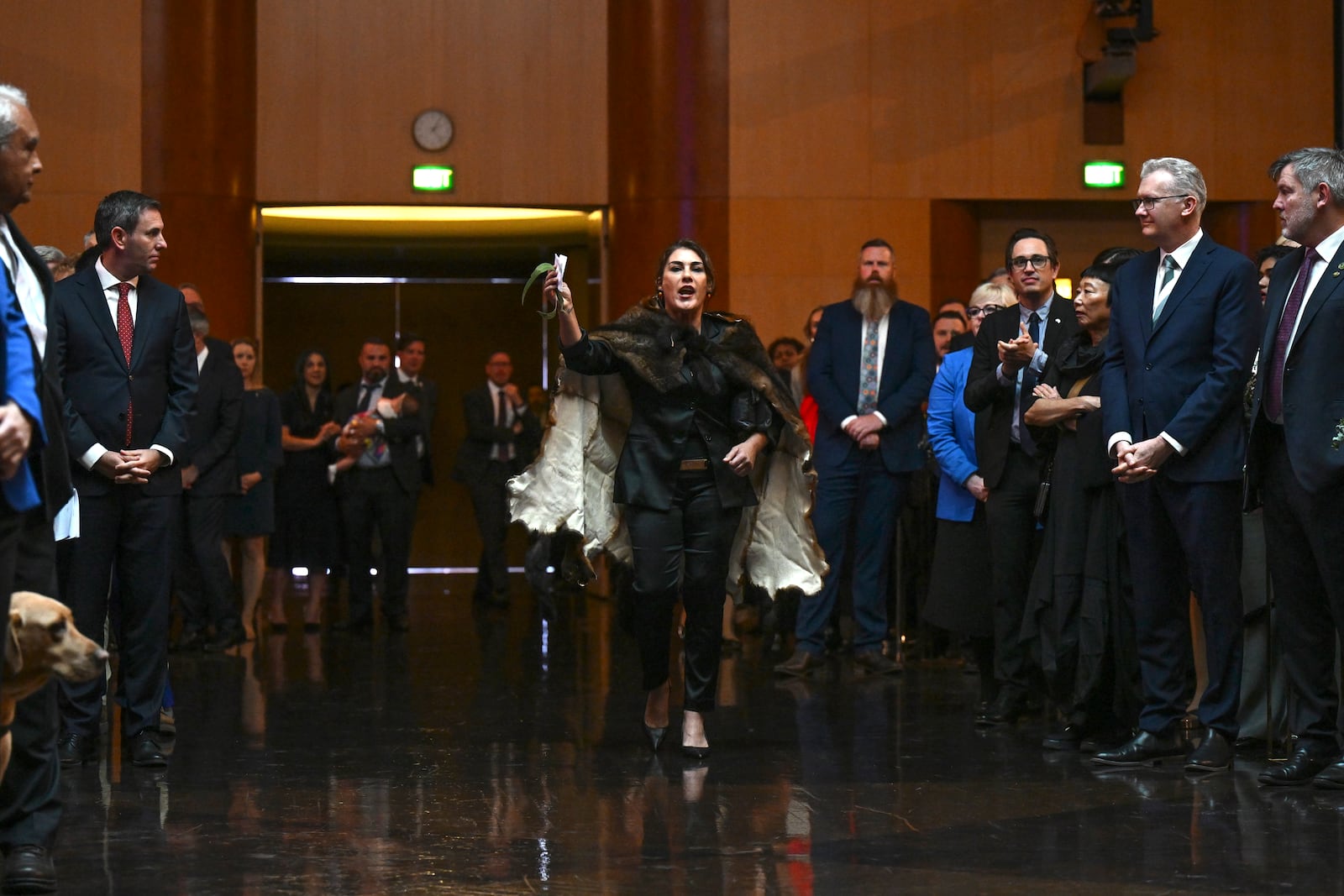 Australian Senator Lidia Thorpe, center, disrupts proceedings as Britain's King Charles III and Queen Camilla attend a Parliamentary reception hosted by Australian Prime Minister Anthony Albanese and partner Jodie Jaydon at Parliament House in Canberra, Australia, Monday, Oct. 21, 2024. (Lukas Coch/Pool Photo via AP)