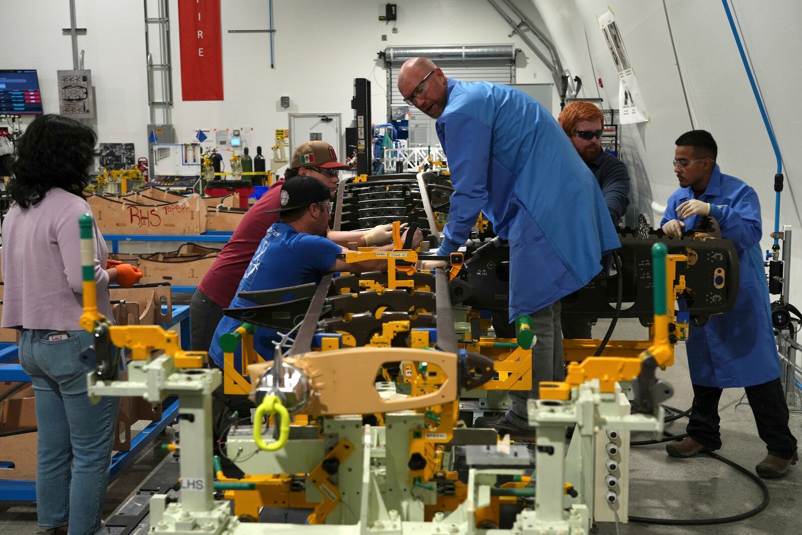 Joby Aviation employees assemble parts for an "electric vertical takeoff and landing" eVTOL aircraft in Marina, Calif. on Monday, Oct. 7, 2024. (AP Photo/Terry Chea)