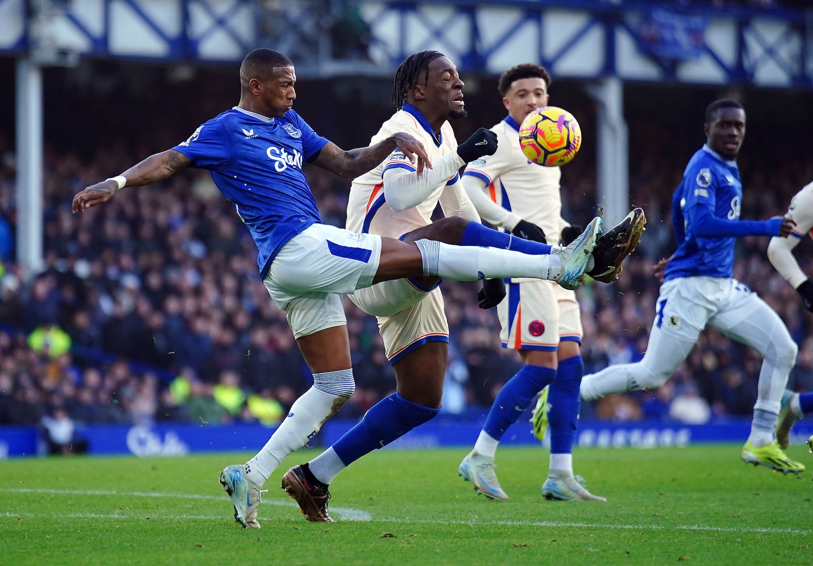 Everton's Ashley Young (left) and Chelsea's Axel Disasi battle for the ball during the English Premier League match soccer match between Everton and Chelsea, at Goodison Park, Liverpool, England, Sunday Dec. 22, 2024. (Peter Byrne/PA via AP)