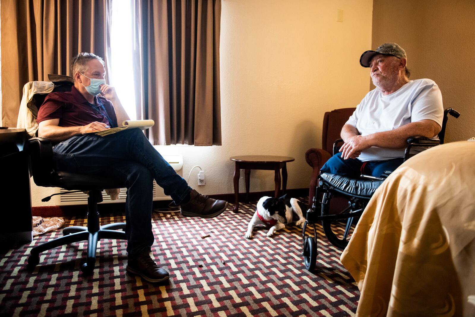 Army veteran Charles Knuckles tells his story about how he ended up staying at a hotel in Middletown. Knuckles lost his legs due to complications from injuries he sustained in the Army. NICK GRAHAM / STAFF