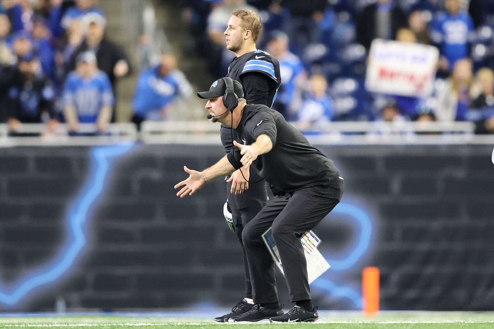 Detroit Lions head coach Dan Campbell, bottom, reacts next to quarterback Jared Goff during the second half of an NFL football game against the Buffalo Bills, Sunday, Dec. 15, 2024, in Detroit. (AP Photo/Rey Del Rio)