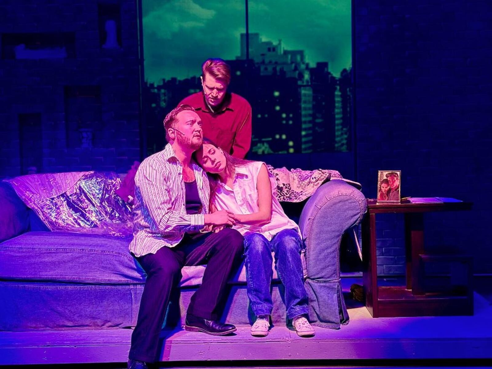 Montana Iverson (Sam Wheat, standing), Dylan Jackson (Carl Bruner) and Charmien Byrd (Molly Jensen) in La Comedia Dinner Theatre's production of "Ghost: The Musical." PHOTO BY JUSTIN WALTON