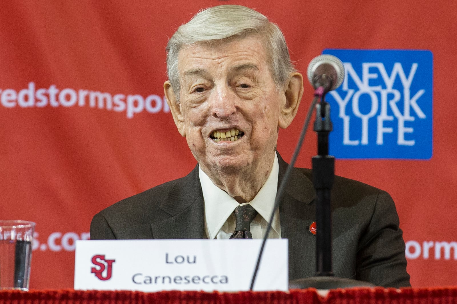 FILE - Former St. John's men's basketball coach Lou Carnesecca smiles during a news conference to announce the hiring of his former player and retired NBA basketball All-Star Chris Mullin, on April 1, 2015, in New York. (AP Photo/John Minchillo, File)