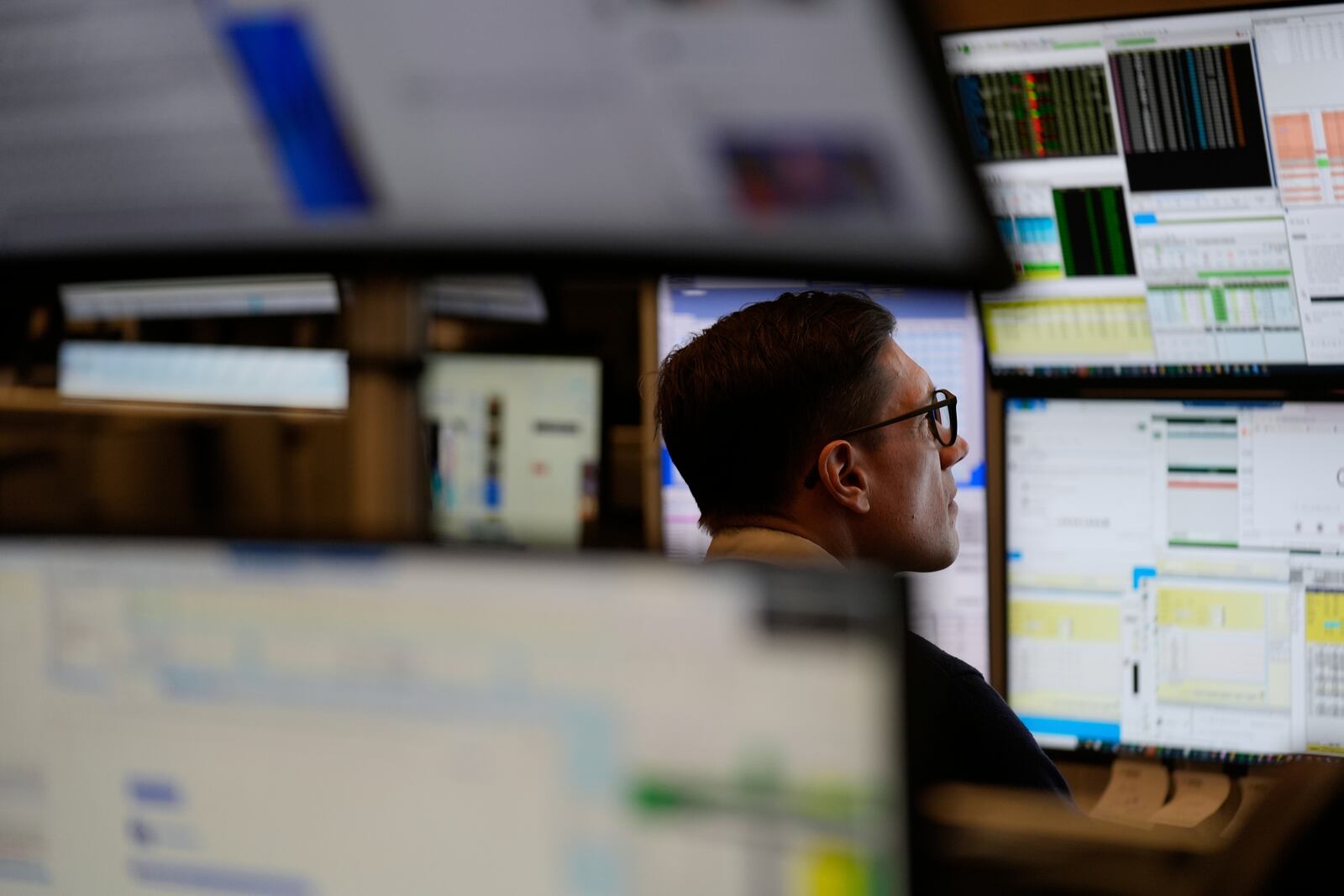 People work on the options floor at the New York Stock Exchange in New York, Wednesday, March 19, 2025. (AP Photo/Seth Wenig)