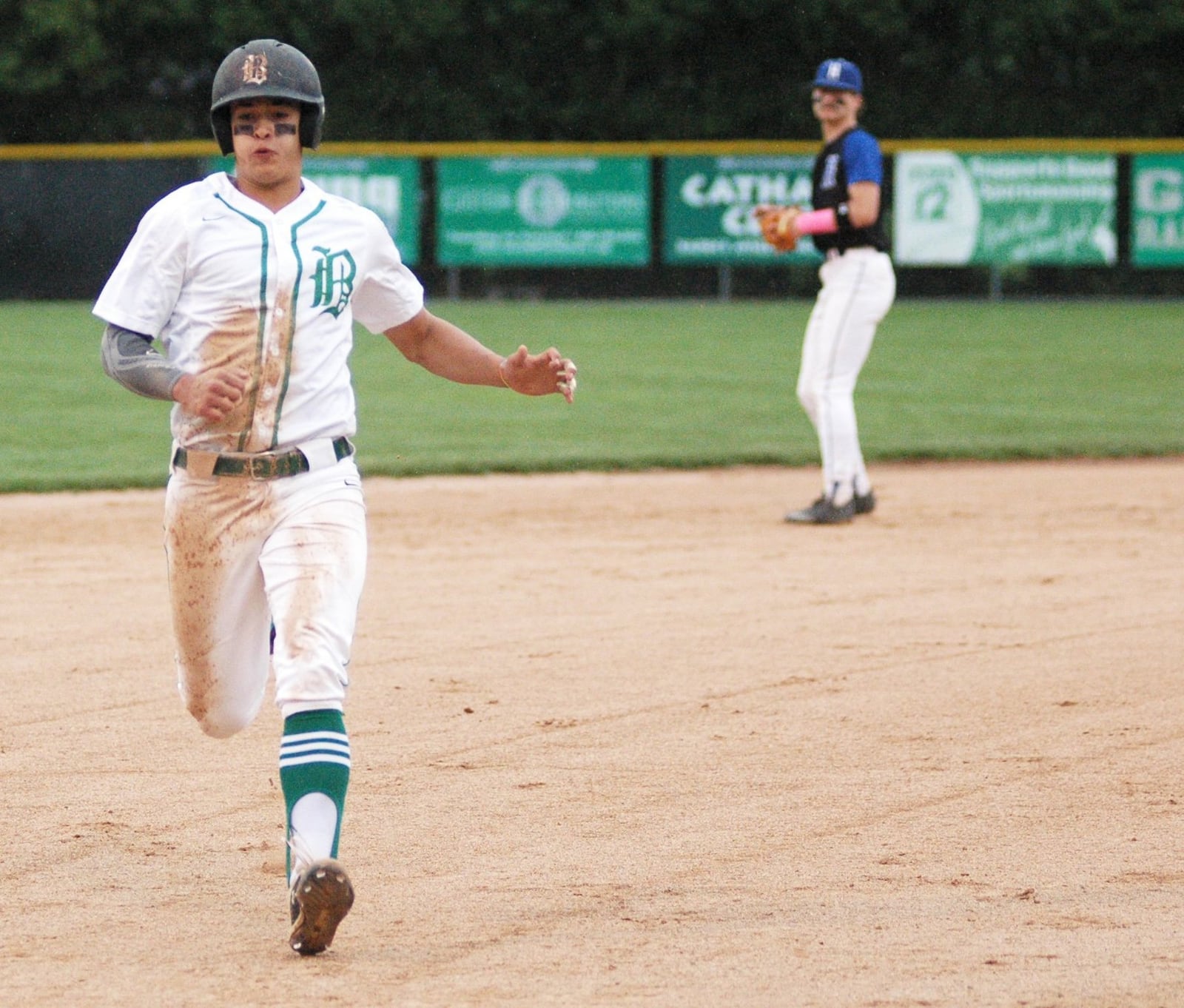 Badin’s Sergio DeCello heads toward third base during Saturday’s 9-7 victory over visiting Hamilton at Alumni Field. RICK CASSANO/STAFF