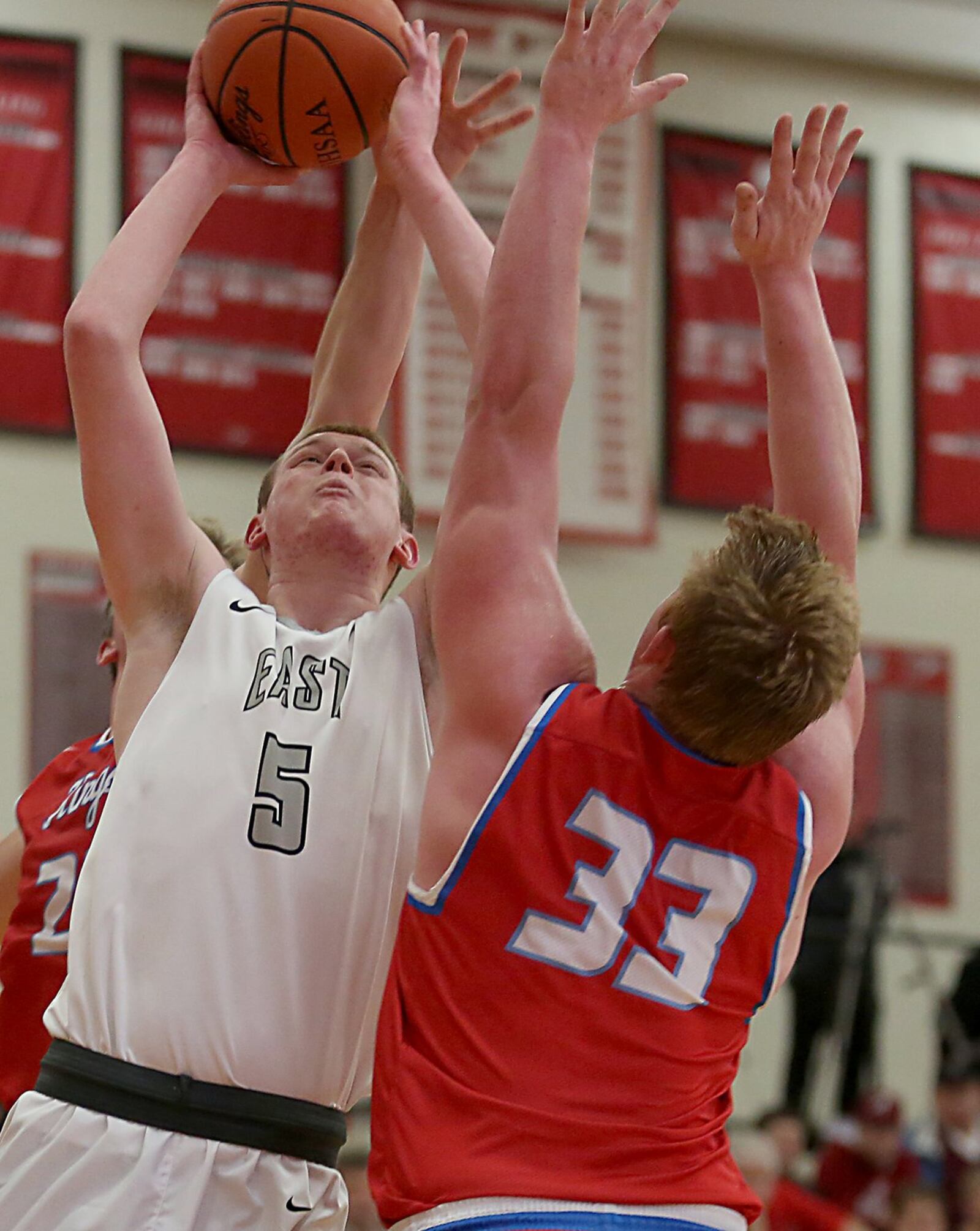 Lakota East forward Evan Kuhlman shoots over Kings forward Matt Sichterman on Wednesday night during their Division I sectional game at Lakota West. CONTRIBUTED PHOTO BY E.L. HUBBARD