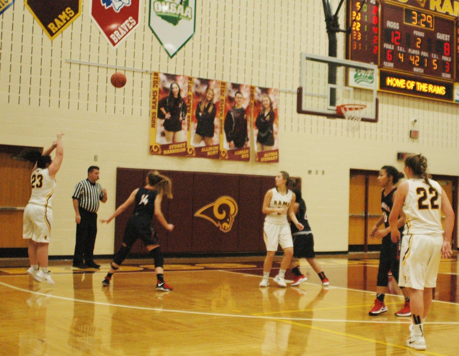 Kellan Romans (23) of Ross puts up a shot over Talawanda’s Sophie Pohlabel (14) during Wednesday night’s game in Ross Township. The host Rams won 26-25. RICK CASSANO/STAFF