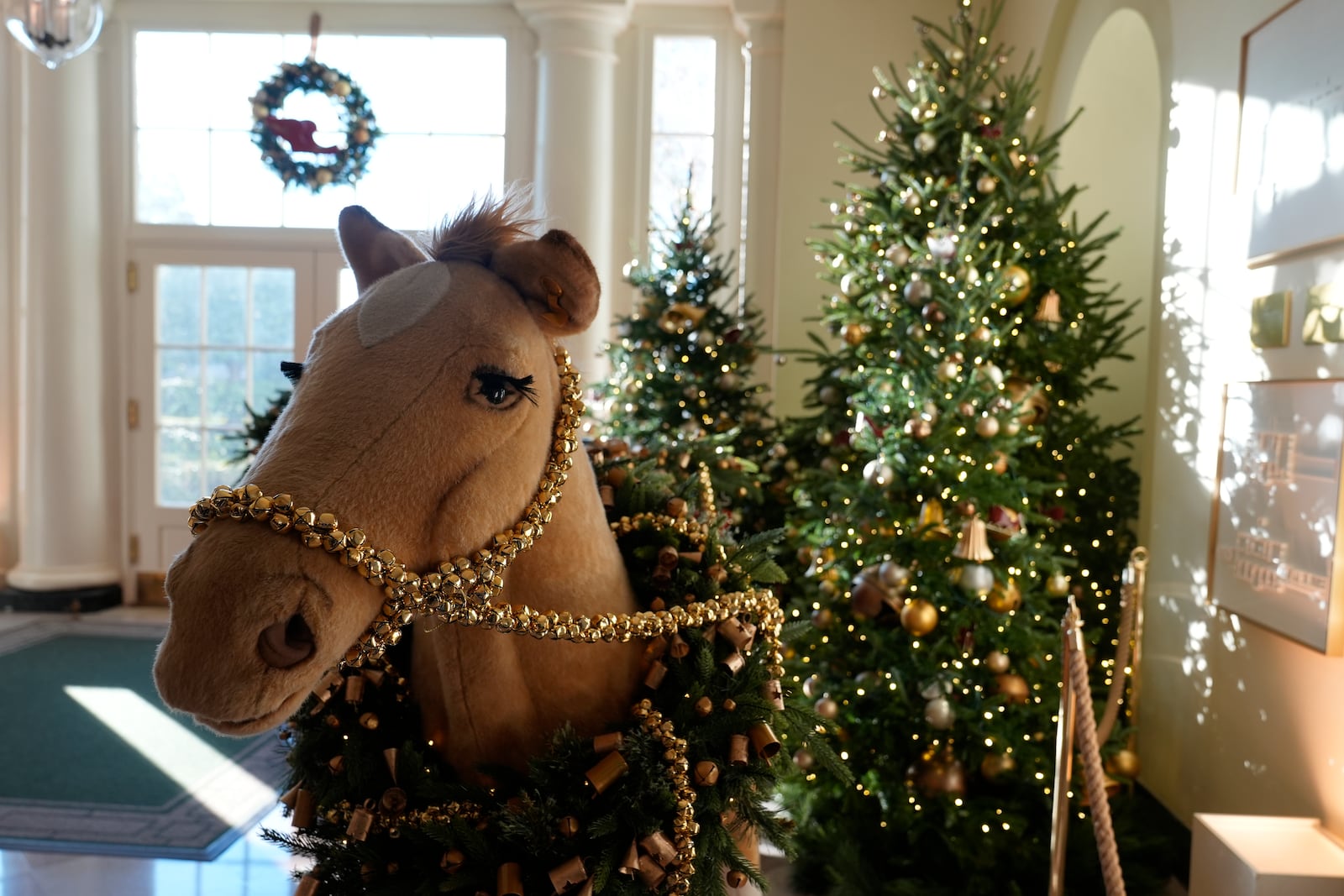 The East Garden Room of the White House in Washington, is decorated for the holidays, Monday, Dec. 2, 2024. (AP Photo/Susan Walsh)