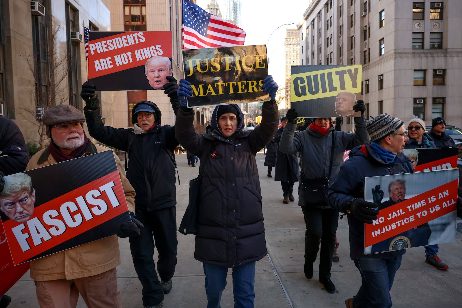 Demonstrators protest outside Manhattan criminal court before the start of the sentencing in President-elect Donald Trump's hush money case, Friday, Jan. 10, 2025, in New York. (AP Photo/Yuki Iwamura)