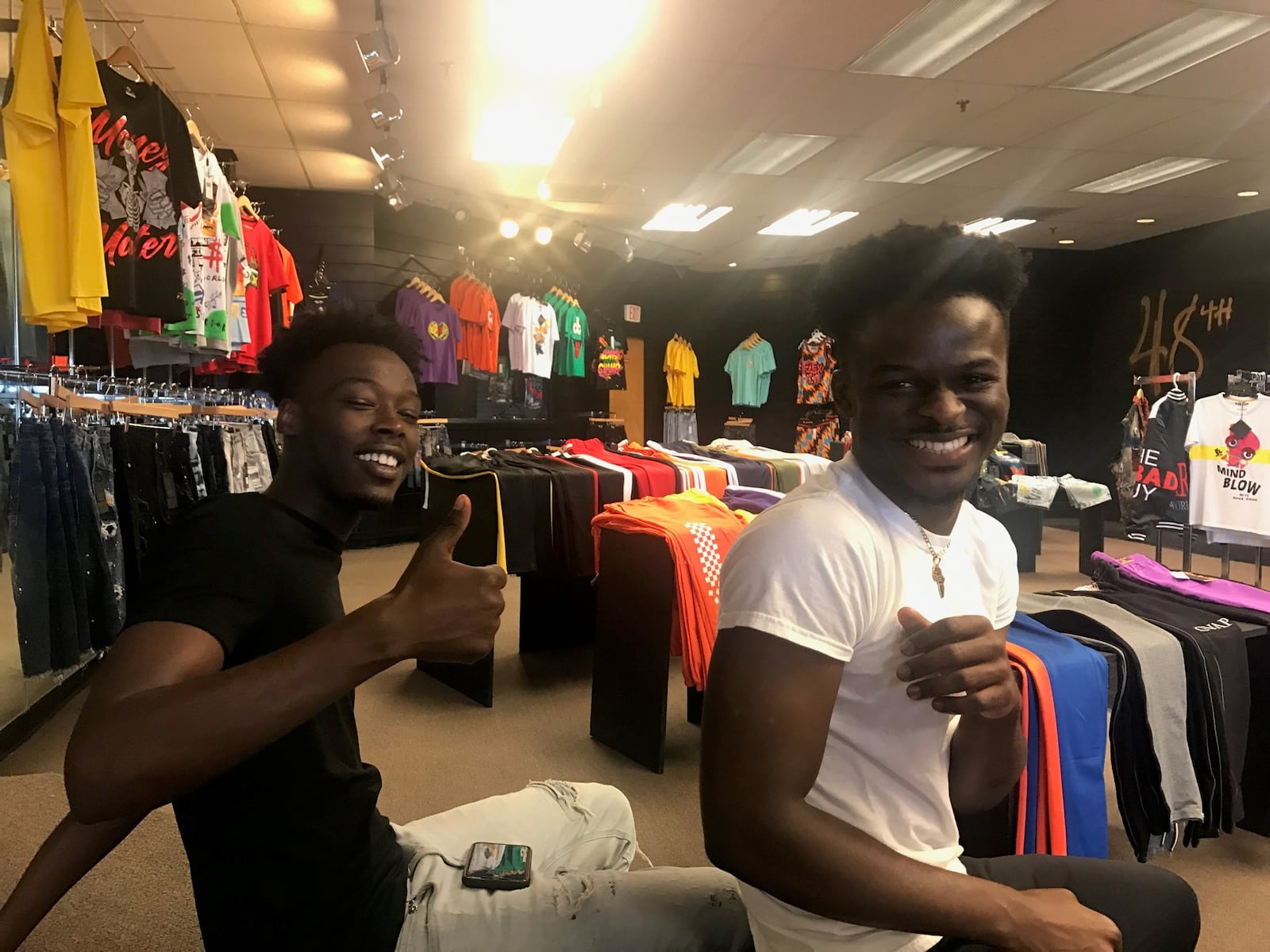 Mustafa Ibrahim (left ) and Herbert Chongwain (right) – former Belmont High soccer teammates  -- in the 48th Clothing  store they opened two months ago at the Northwest Plaza. Tom Archdeacon/STAFF