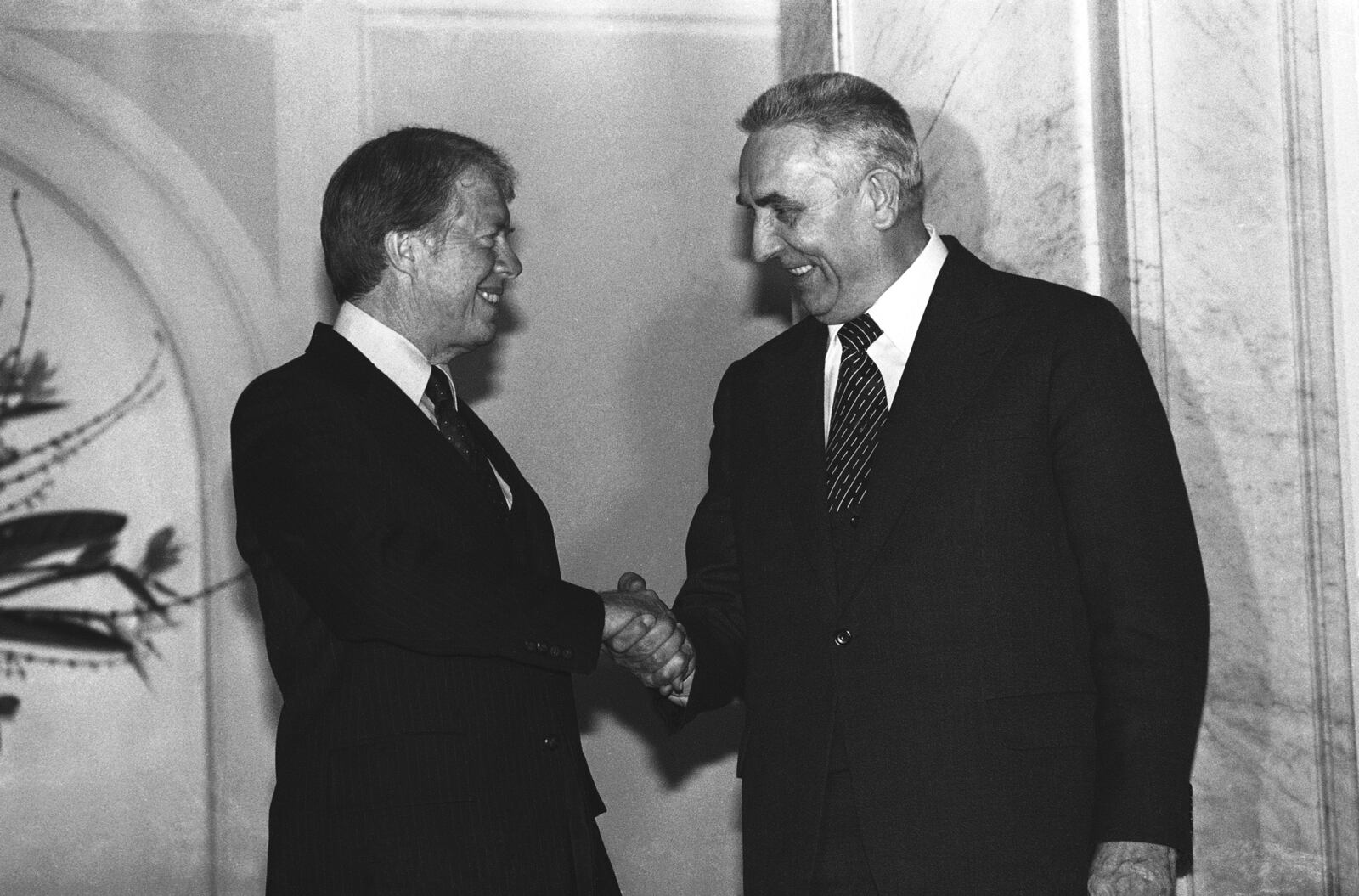 FILE - President Jimmy Carter and Polish First Secretary Edward Gierek shake hands after their formal talks in Warsaw on Dec. 30, 1977. (AP Photo, File)