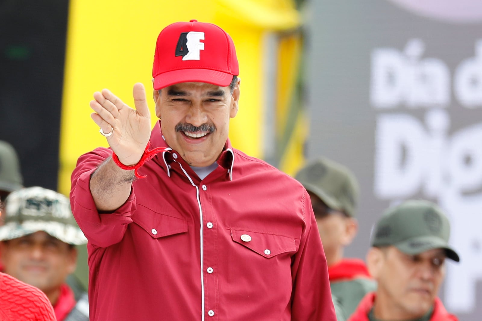 Venezuela's President Nicolas Maduro waves to supporters during an event marking the anniversary of the 1992 failed coup led by the late President Hugo Chavez in Caracas, Venezuela, Tuesday, Feb. 4, 2025. (AP Photo/Cristian Hernandez)