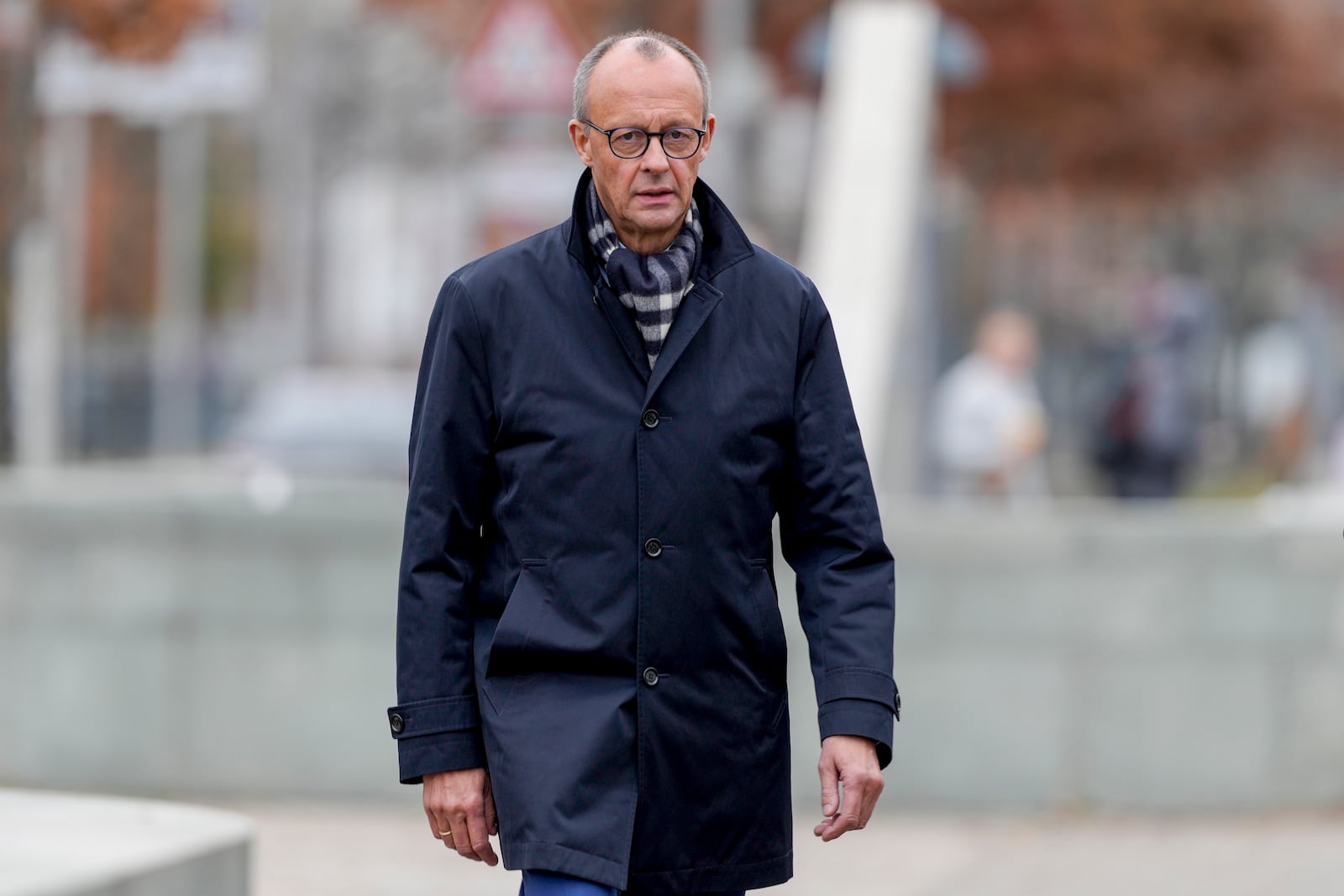 German opposition leader and Christian Union parties floor leader Friedrich Merz arrives for a meeting with German Chancellor Olaf Scholz at the chancellery in Berlin, Thursday, Nov.7, 2024. (AP Photo/Markus Schreiber)