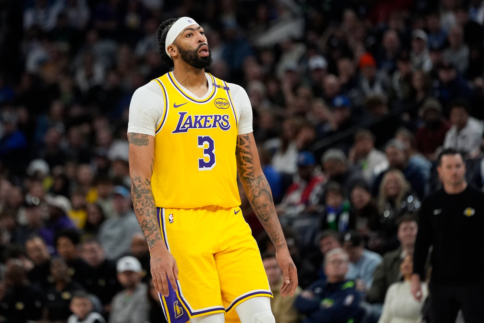 Los Angeles Lakers forward Anthony Davis reacts after missing a basket during the second half of an NBA basketball game against the Minnesota Timberwolves, Friday, Dec. 13, 2024, in Minneapolis. (AP Photo/Abbie Parr)