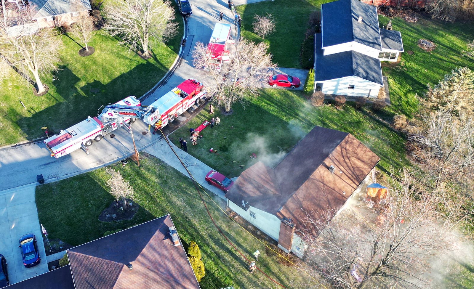 The Monroe Fire Department responded to a house fire Tuesday night on Sunset Court. One resident was transported to Atrium Medical Center with unknown injuries. NICK GRAHAM/STAFF