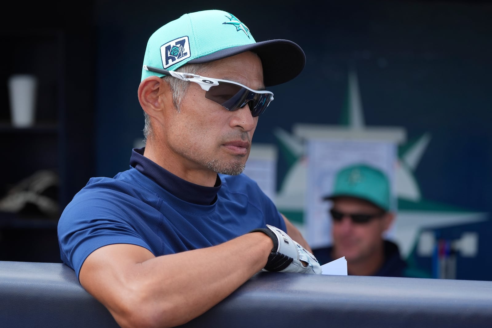 MLB Hall of Fame inductee for 2025 and former Seattle Mariners' Ichiro Suzuki, of Japan, pauses in the Mariners dugout prior to a spring training baseball game against the Kansas City Royals Wednesday, March 12, 2025, in Peoria, Ariz. (AP Photo/Ross D. Franklin)