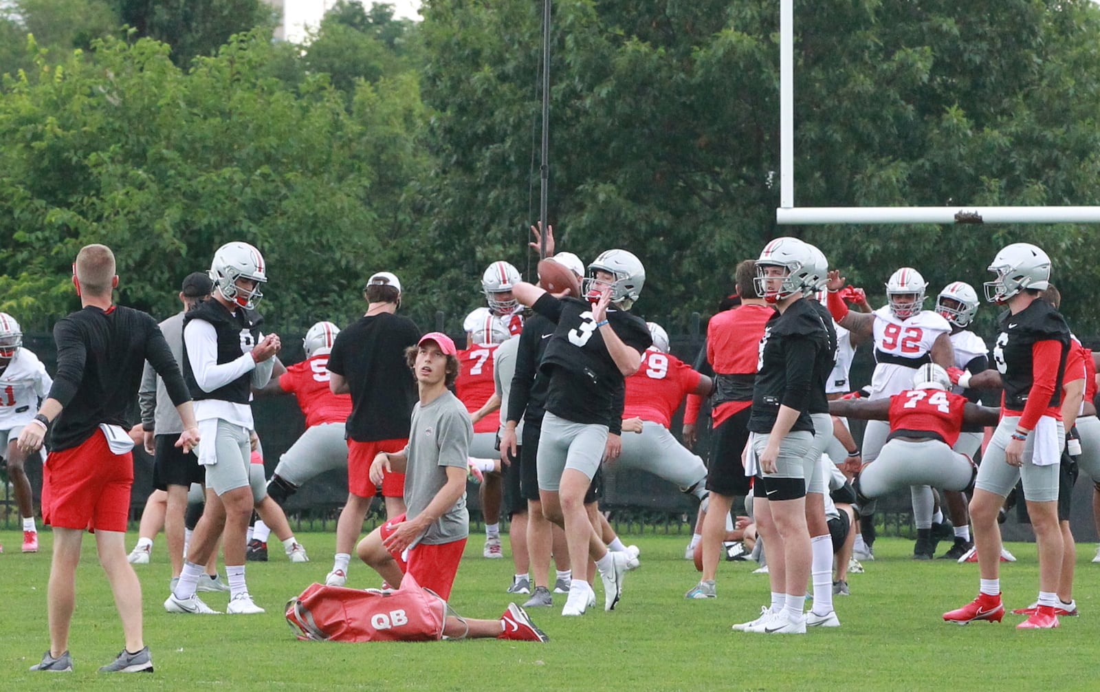 Quinn Ewers throws a pass at Ohio State Buckeyes football practice in August of 2021. Marcus Hartman/STAFF