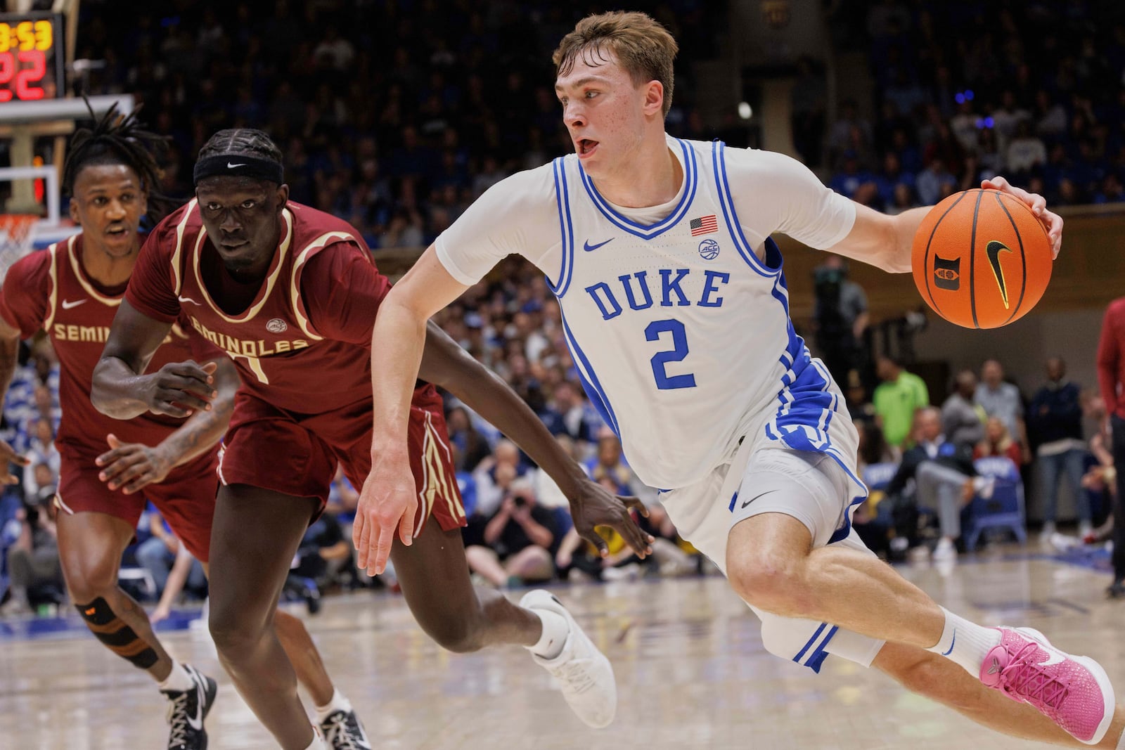 FILE - Duke's Cooper Flagg (2) drives past Florida State's Jerry Deng, second from left, during the second half of an NCAA college basketball game in Durham, N.C., Saturday, March 1, 2025. (AP Photo/Ben McKeown, File)