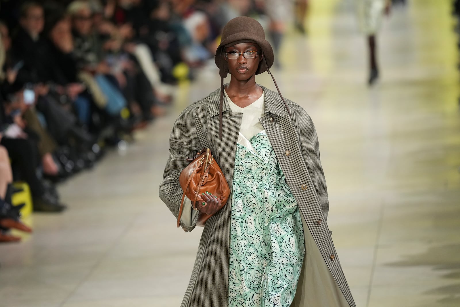 A model wears a creation as part of the Miu Miu Fall/Winter 2025-2026 Womenswear collection presented Tuesday, March 11, 2025. in Paris. (Photo by Scott A Garfitt/Invision/AP)