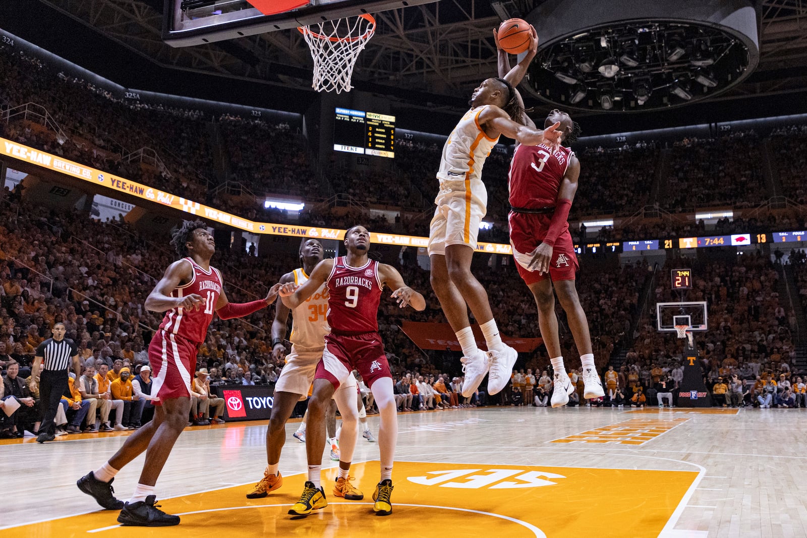 Tennessee guard Chaz Lanier (2) has his shot blocked by Arkansas forward Adou Thiero (3) during the first half of an NCAA college basketball game Saturday, Jan. 4, 2025, in Knoxville, Tenn. (AP Photo/Wade Payne)