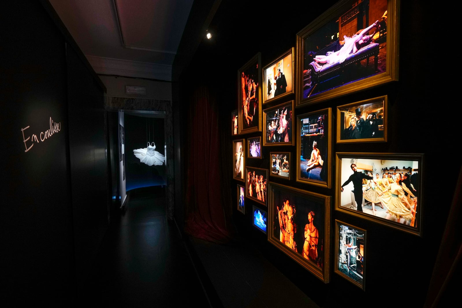 Pictures are displayed during the unveiling of the photo exhibition 'Lo sguardo nascosto' ( The hidden gaze) by photographer Gerard Uferas, at the La Scala Opera House in Milan, Italy, Tuesday, Feb. 11, 2025. (AP Photo/Luca Bruno)