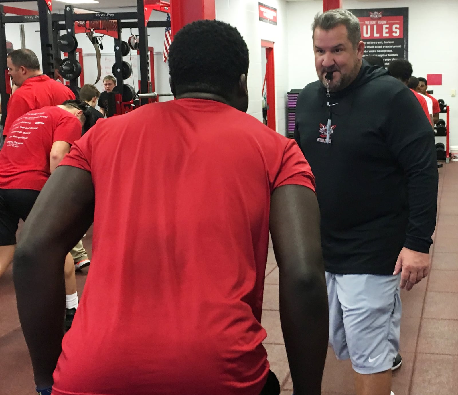 New Lakota West High School football coach Tom Bolden oversees a drill during a workout session at the school Thursday afternoon. RICK CASSANO/STAFF