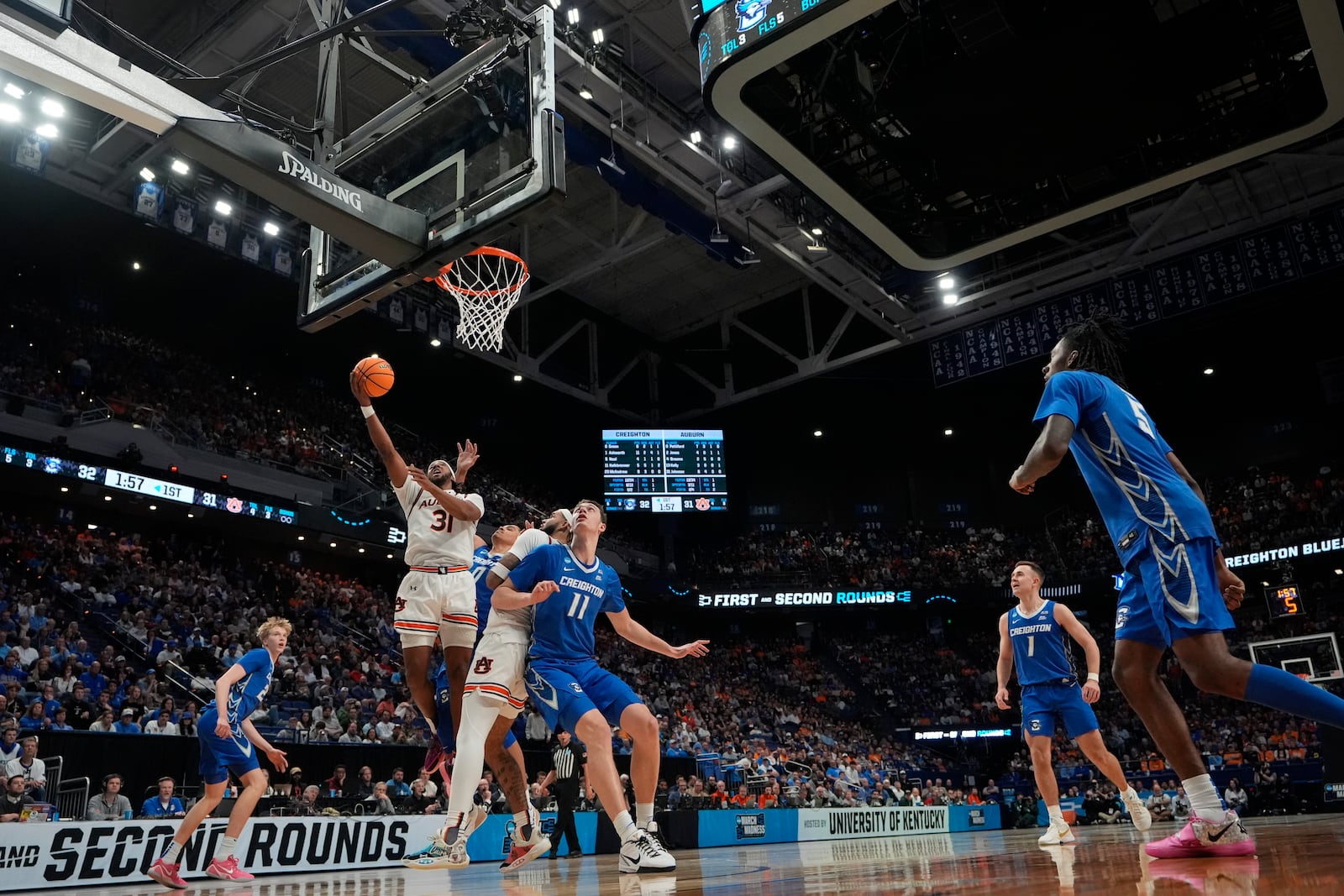 Auburn forward Chaney Johnson (31) shoots the ball during the first half in the second round of the NCAA college basketball tournament against Creighton, Saturday, March 22, 2025, in Lexington, Ky. (AP Photo/Brynn Anderson)