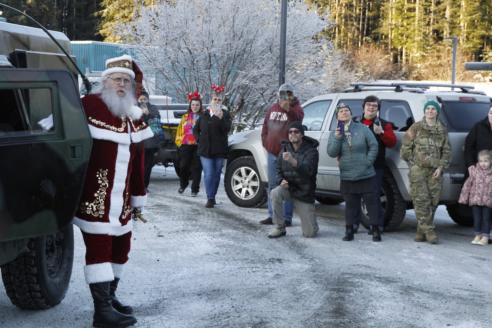 Santa Claus arrives at the school in Yakutat, Alaska,, as part of the Alaska National Guard's Operation Santa initiative that brings Christmas to an Indigenous community that has suffered a hardship, Wednesday, Dec. 18, 2024. (AP Photo/Mark Thiessen).