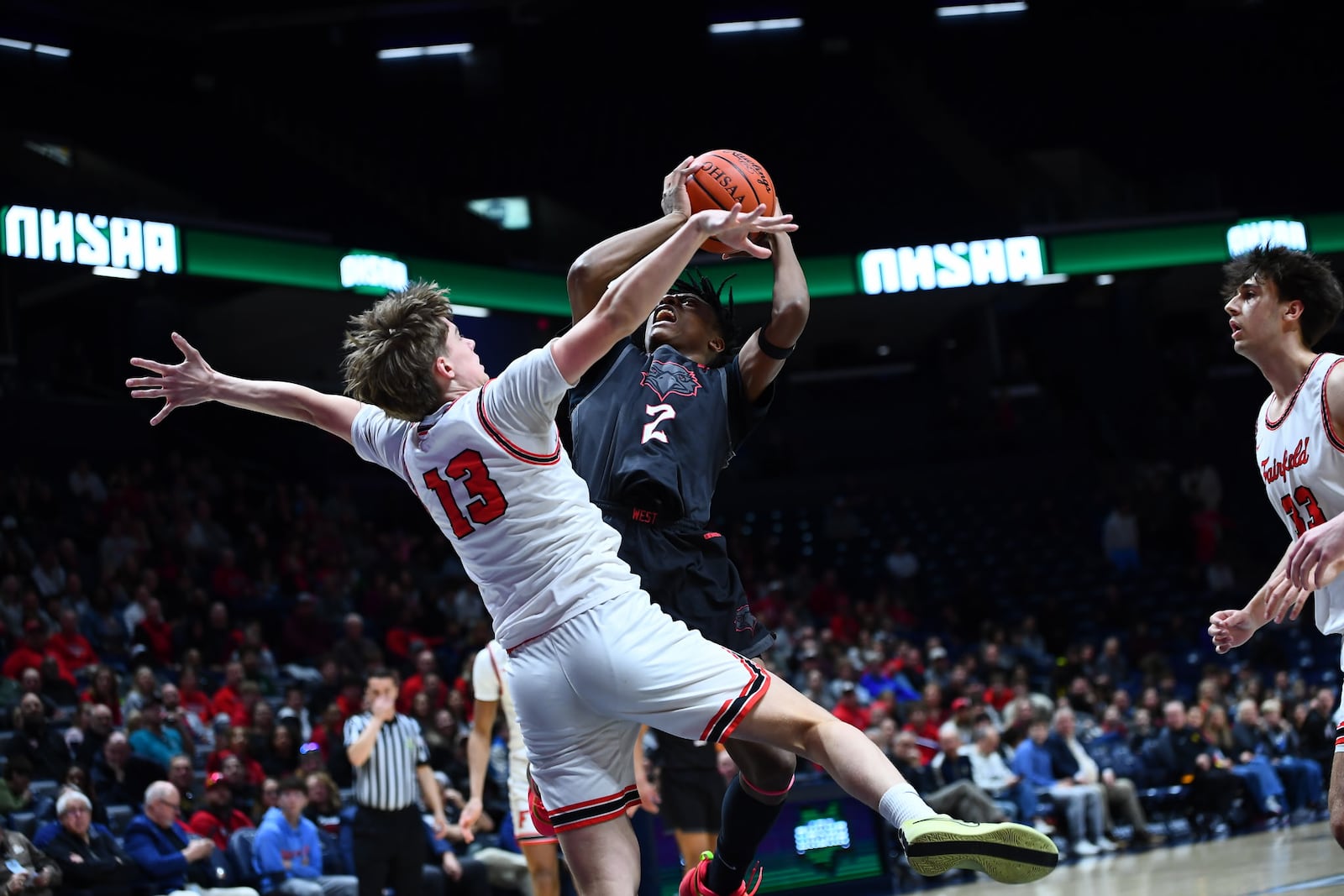 Lakota West's Josh Tyson (2) goes up for a shot over Fairfield's Riley Cunningham (13) in a Division I regional final on Sunday at Xavier University's Cintas Center. Chris Vogt/CONTRIBUTED