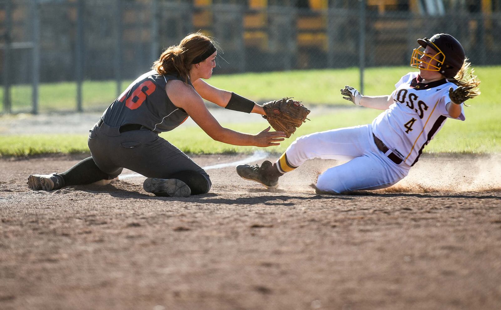 Wilmington's Kacy Younker tags out Adrianne Gleason of Ross at third base during their Division II sectional final Tuesday at Kings. NICK GRAHAM/STAFF