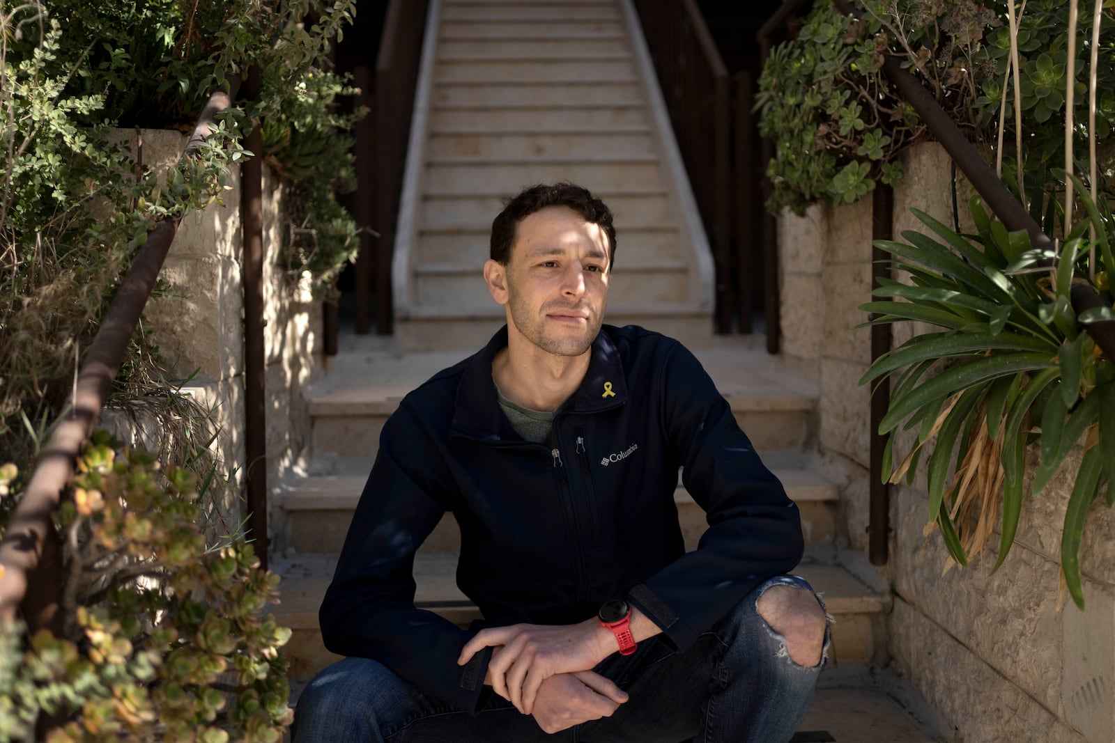 Max Kresch, an army reserve medic who has joined a growing number of Israeli soldiers speaking out against the 15-month conflict in the Gaza Strip and are refusing to continue fighting, poses for a portrait in Jerusalem on Thursday, Jan. 9, 2025. (AP Photo/Maya Alleruzzo)