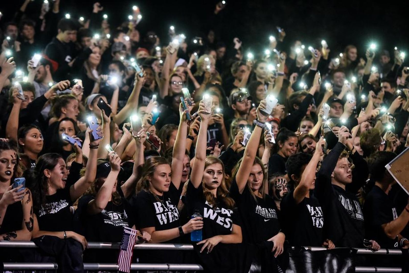 Lakota East football fans make the night brighter Sept. 29, 2017, at Lakota West. East posted a 35-0 victory in the matchup of district rivals. NICK GRAHAM/STAFF