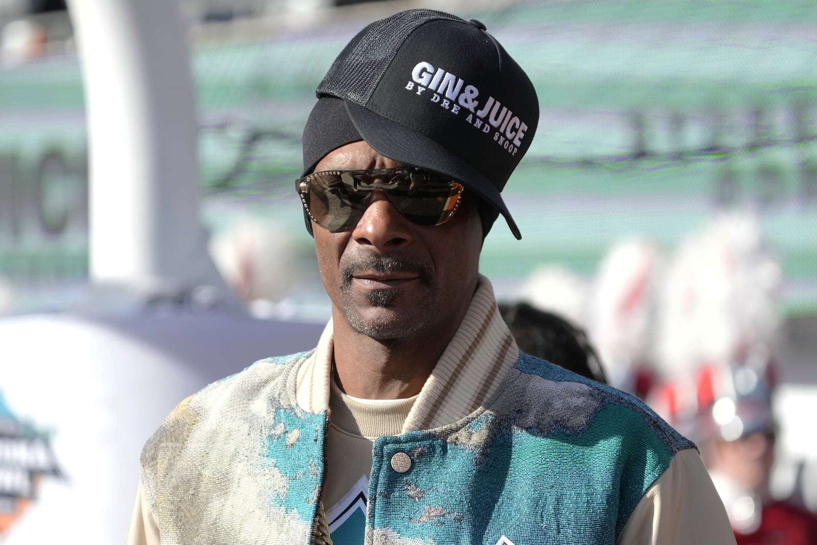 Snoop Dogg makes an appearance before the Arizona Bowl NCAA college football game between Colorado State and Miami (Ohio), Saturday, Dec. 28, 2024, in Tucson, Ariz.