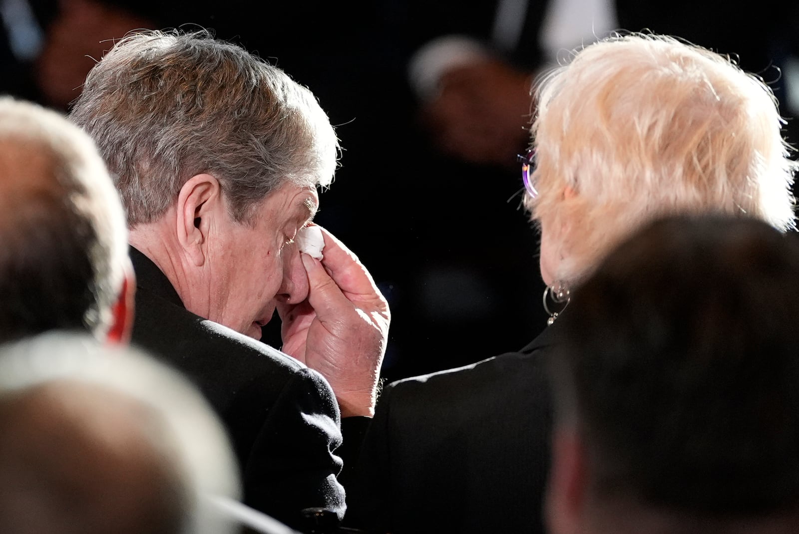 James "Chip" Carter wipes his eyes after speaks during a service for former President Jimmy Carter at the Jimmy Carter Presidential Library and Museum in Atlanta, Saturday, Jan. 4, 2025, as he sits next to his wife Becky. Carter died Dec. 29 at the age of 100. (AP Photo/Alex Brandon, Pool)