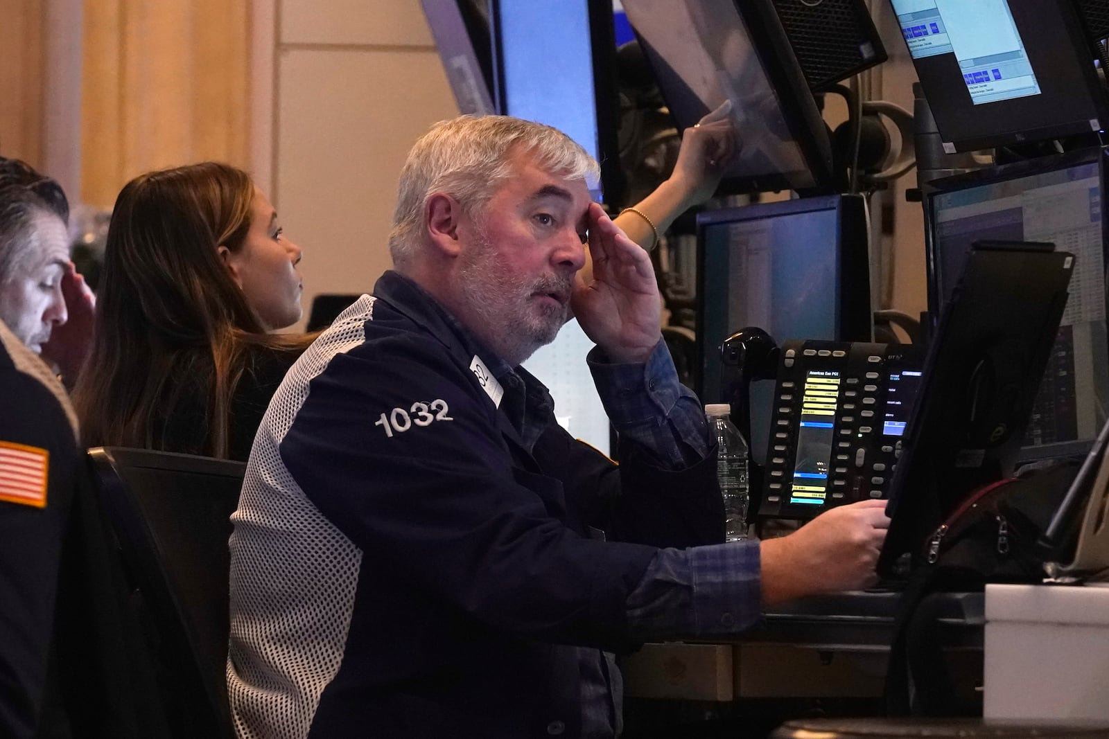 Traders work on the floor of the New York Stock Exchange, Tuesday, March 11, 2025. (AP Photo/Richard Drew)