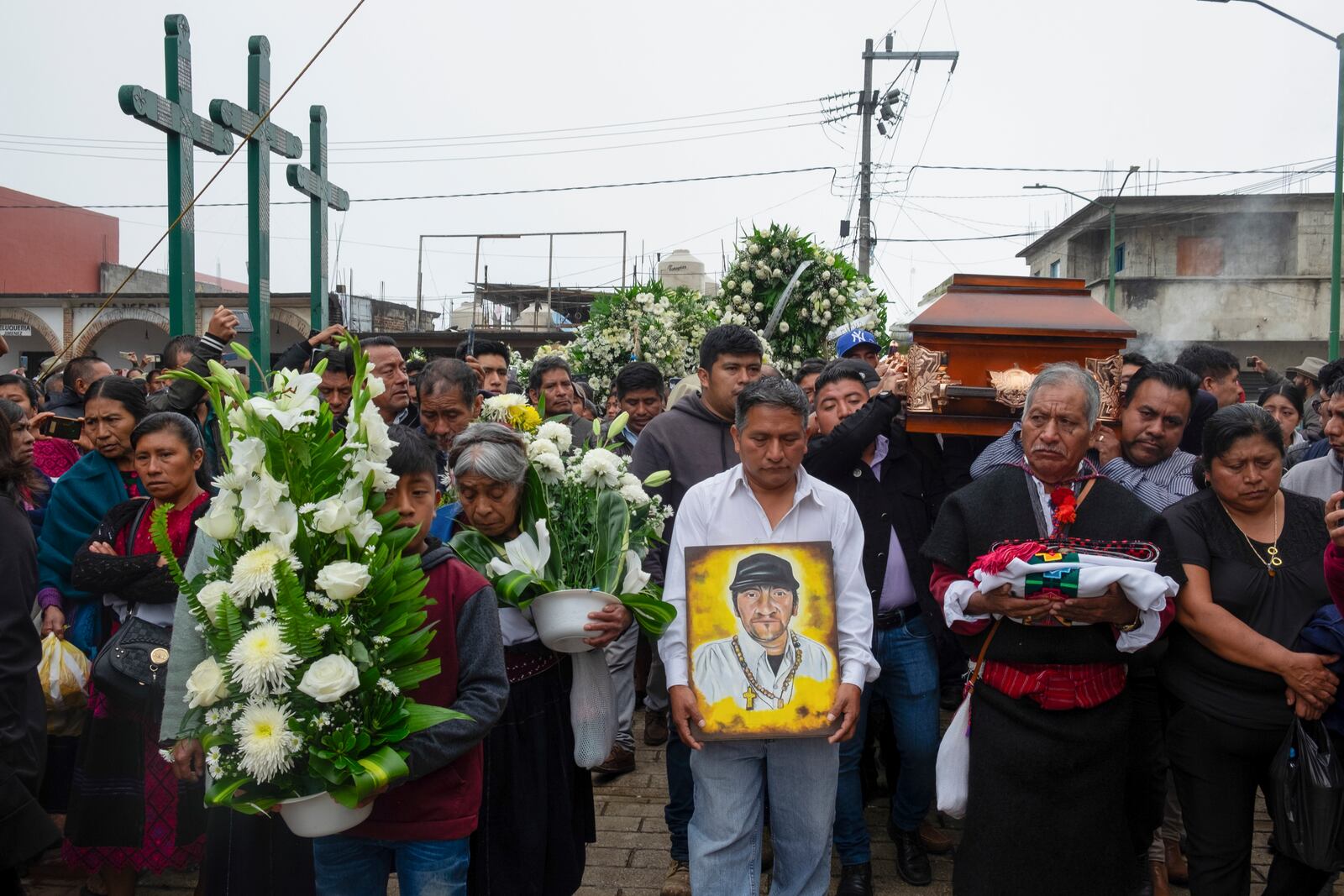 Residents take part in a funeral procession for slain Catholic priest and activist Marcelo Pérez, in San Andrés Larráinzar, Chiapas state, Mexico, Tuesday, Oct. 22, 2024. (AP Photo/Isabel Mateos)