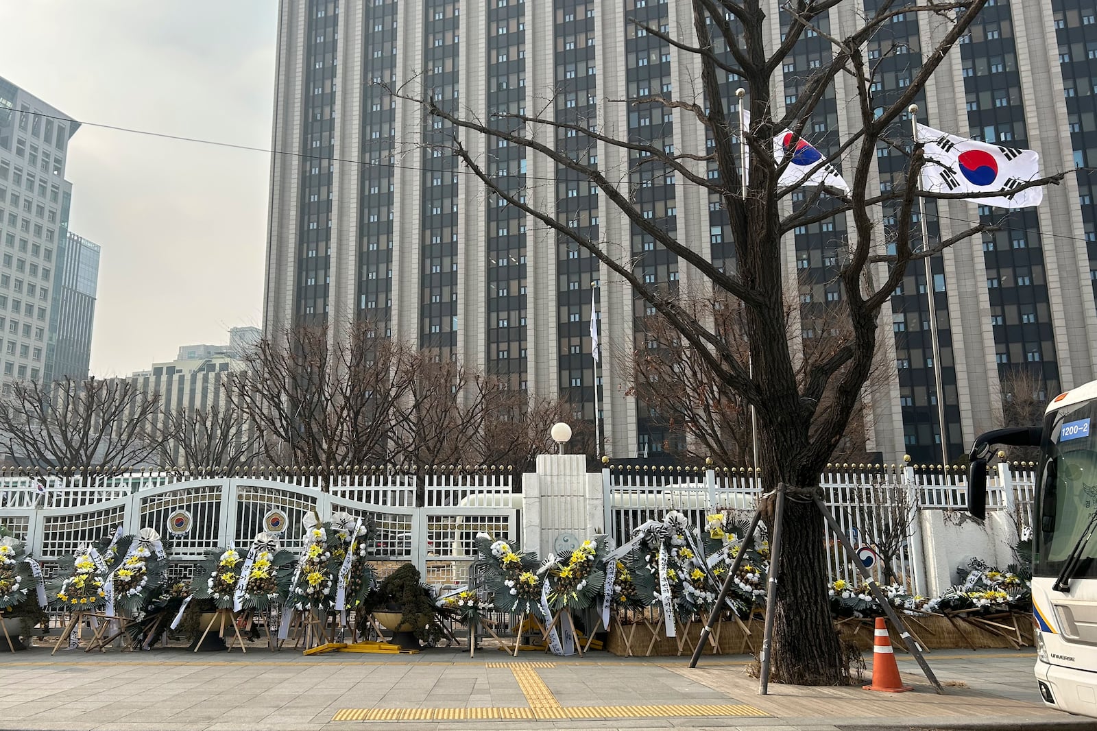 HOLD- Funeral wreaths bearing messages critical of officials involved in South Korea's martial law controversy stand outside the Government Complex Seoul on Monday, Jan. 20, 2025, in Seoul. (AP Photo/Juwon Park)